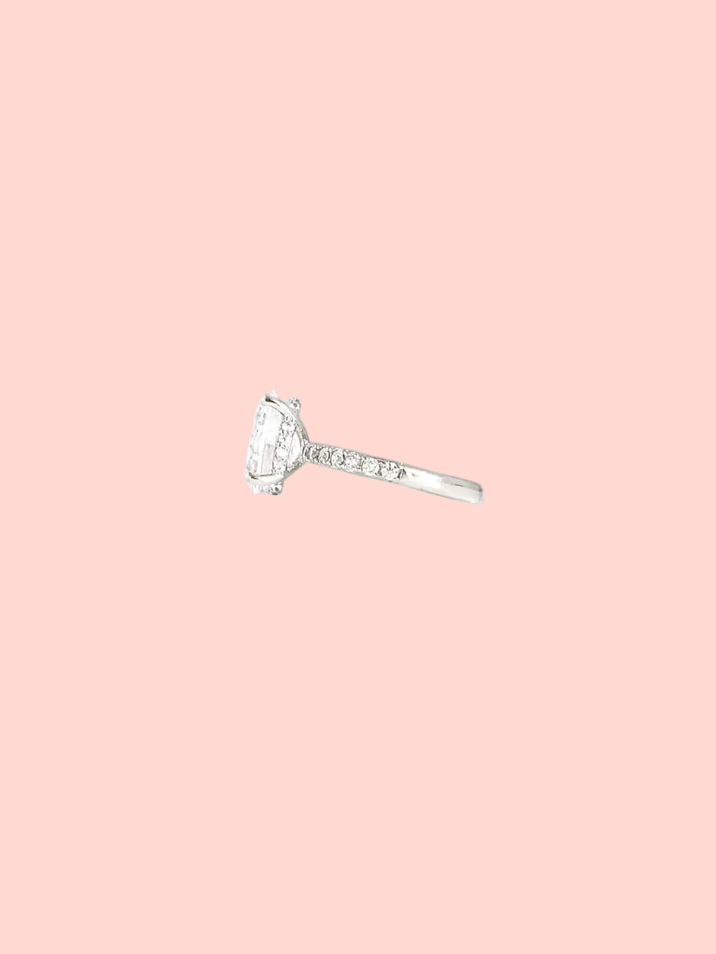 Oval solitaire ring with a statement center stone and pavé details in high quality hand-set CZ, White Gold finish, Size 7