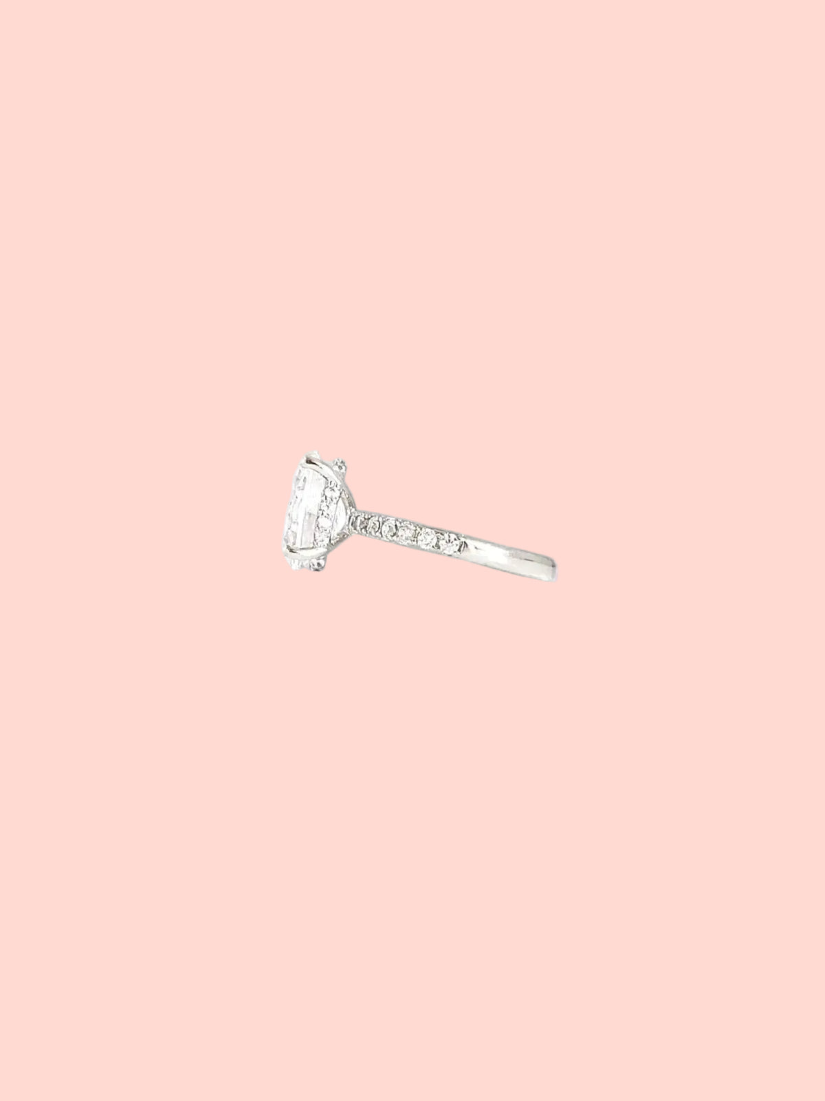 Oval solitaire ring with a statement center stone and pavé details in high quality hand-set CZ, White Gold finish, Size 7