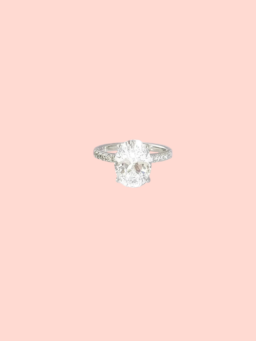 Oval solitaire ring with a statement center stone and pavé details in high quality hand-set CZ, White Gold finish, Size 7